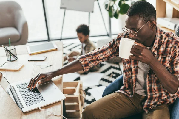 African american father and son in office — Stock Photo