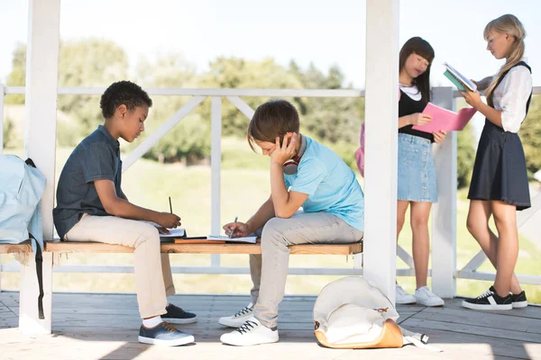 Multiethnic teenagers studying together — Stock Photo
