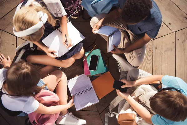 Multiethnic teenagers studying together — Stock Photo