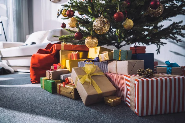 Gifts under christmas tree — Stock Photo
