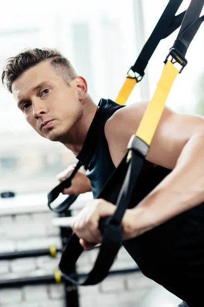 Sportsman training with trx — Stock Photo