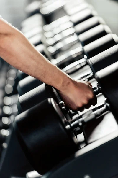 Sportsman training with dumbbells — Stock Photo