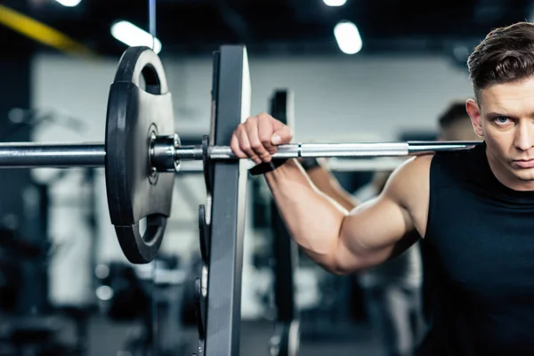 Sportsman lifting barbell — Stock Photo