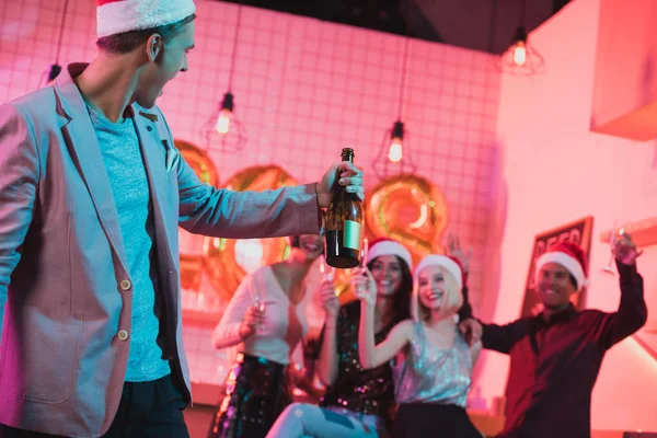 Man with bottle of champagne — Stock Photo