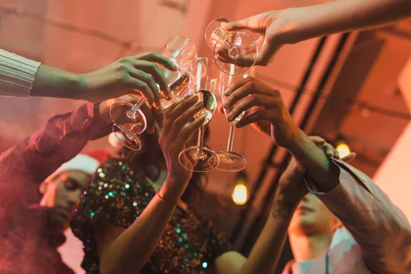 Friends clinking glasses of champagne — Stock Photo