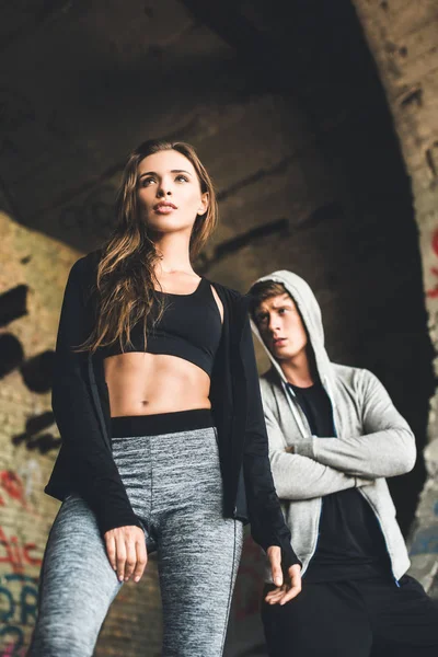 Stylish couple in sportswear — Stock Photo