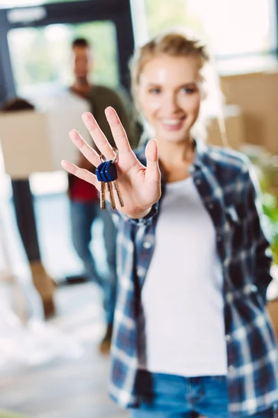 Woman holding keys — Stock Photo