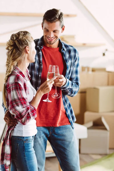 Couple drinking champagne in new house — Stock Photo