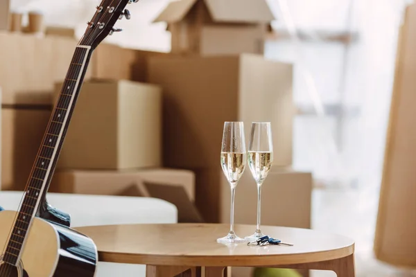 Glasses of champagne in new house — Stock Photo