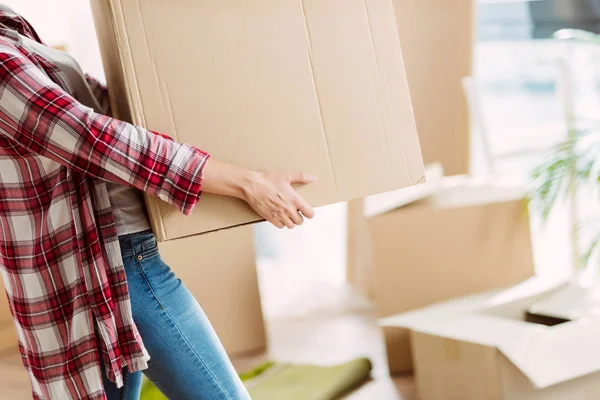 Girl with cardboard boxes — Stock Photo