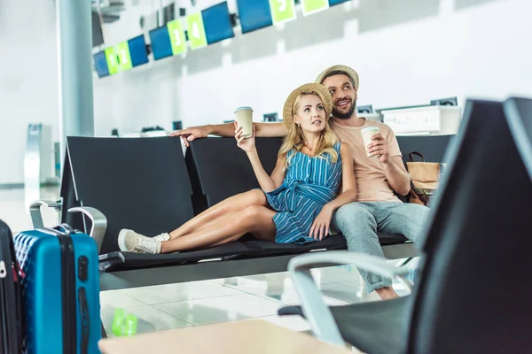Couple waiting for boarding at airport — Stock Photo