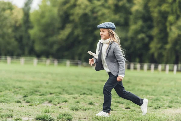 Child running at countryside — Stock Photo