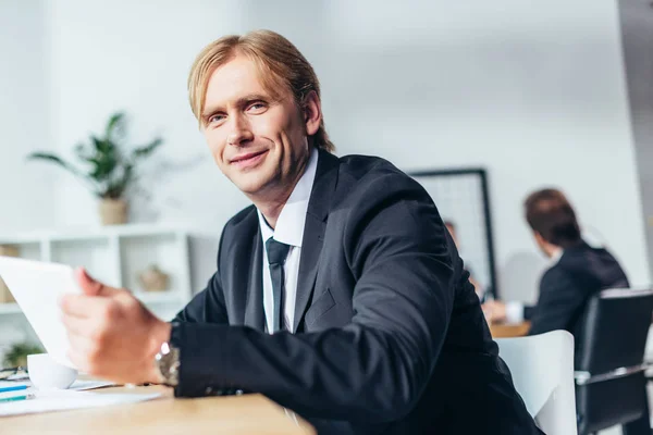 Smiling middle aged businessman — Stock Photo