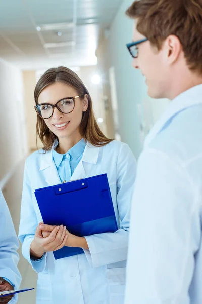 Medical intern in lab coat and glasses — Stock Photo
