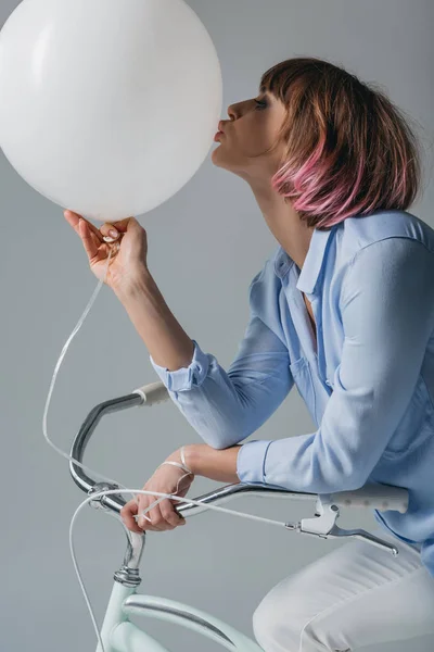 Girl kissing balloon — Stock Photo