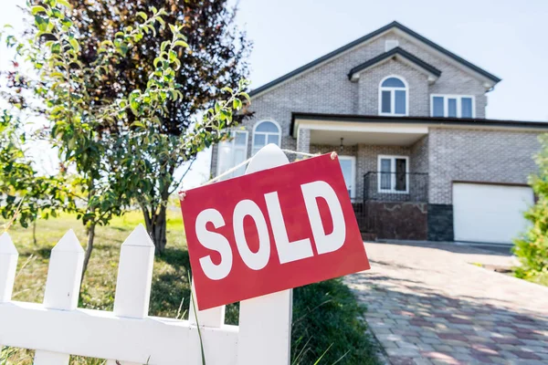 House with sign sold — Stock Photo