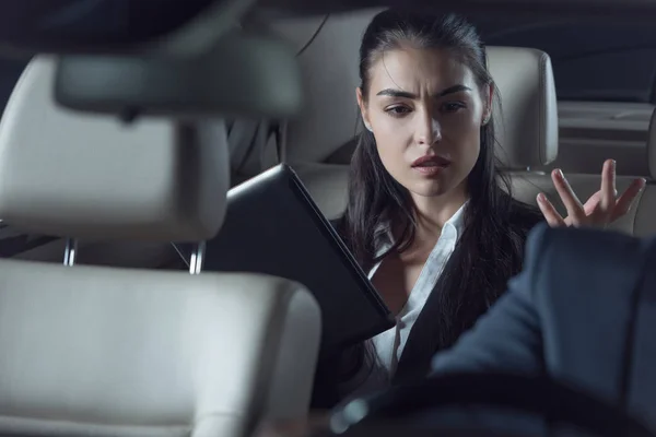 Upset passenger scolding car driver — Stock Photo