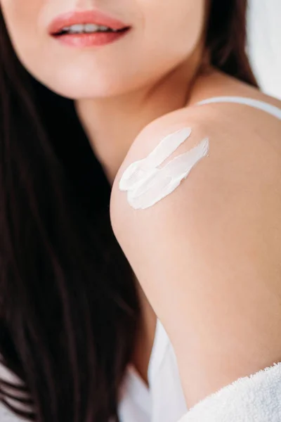 Woman with cream applied to shoulder — Stock Photo