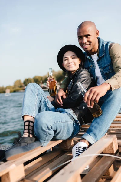 Multicultural couple with drinks — Stock Photo