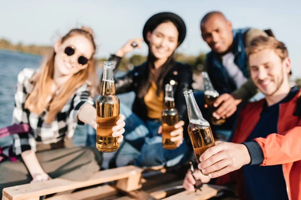 Multicultural friends with drinks — Stock Photo