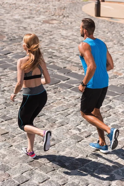 Sport couple jogging in city — Stock Photo