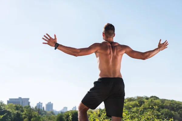 Shirtless sportsman celebrating triumph — Stock Photo