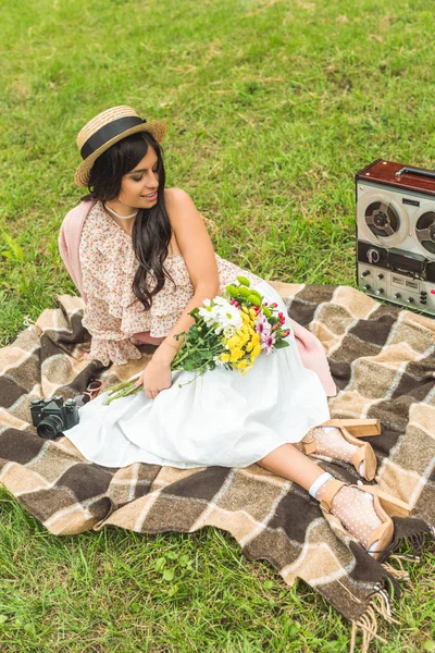 Stylish girl with camera in park — Stock Photo