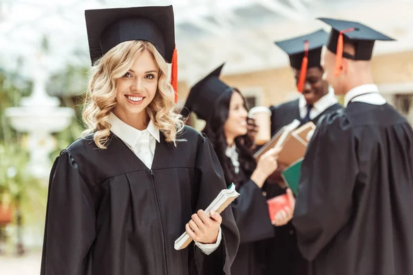 Student girl in graduation costume — Stock Photo