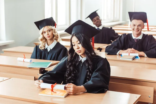 Graduated multiethnic students — Stock Photo