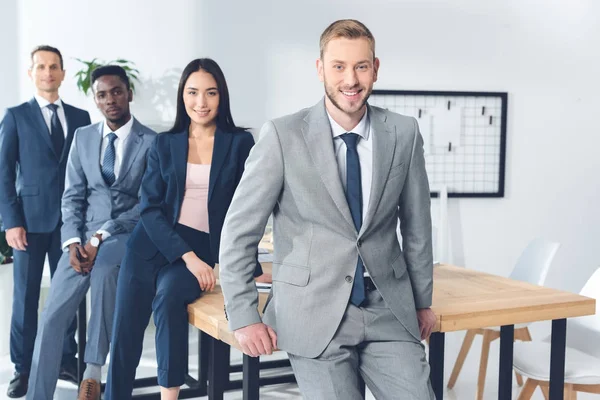 Businesspeople posing in office — Stock Photo