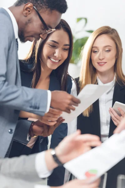 Businesspeople exploring documents — Stock Photo