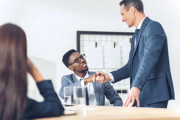 Businessmen shaking hands — Stock Photo