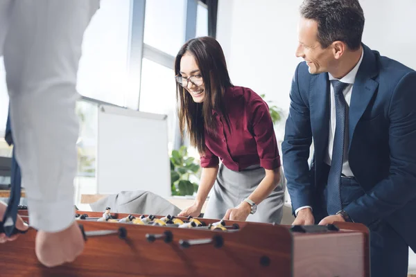 Businesspeople playing table football — Stock Photo