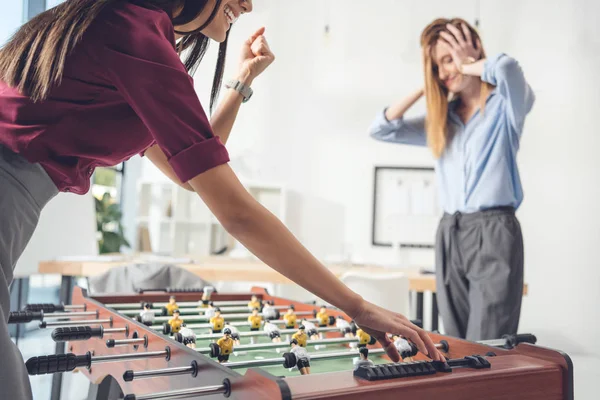 Businesswomen playing table football — Stock Photo