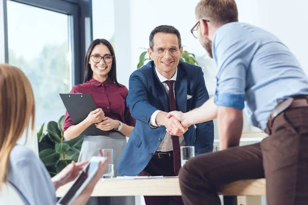 Business partners shaking hands — Stock Photo