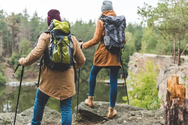 Couple trekking in autumn forest — Stock Photo