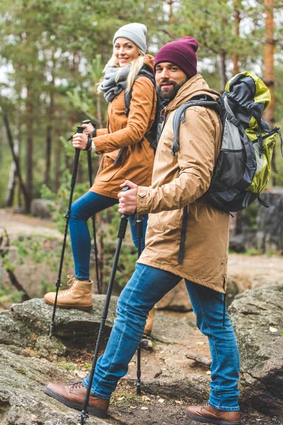 Couple trekking in forest — Stock Photo