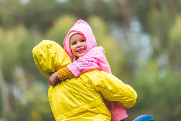 Mother holding little daughter — Stock Photo