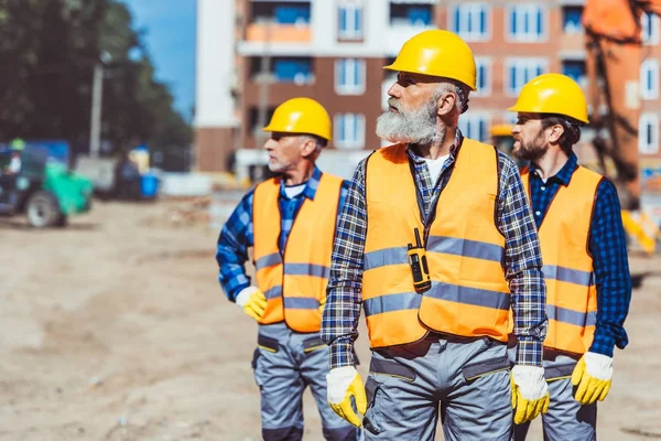 Workers at construction site — Stock Photo