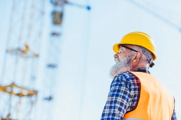 Worker in protective wear at construction site — Stock Photo