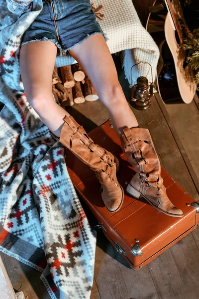 Female hippie legs on suitcase — Stock Photo