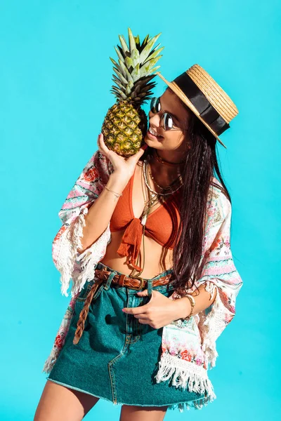 Hippie girl holding pineapple — Stock Photo