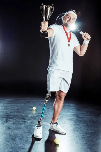 Paralympic tennis player with champion goblet — Stock Photo