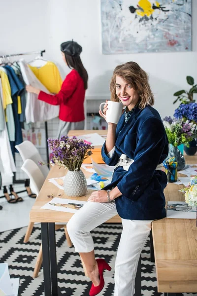 Fashion designer drinking tea — Stock Photo