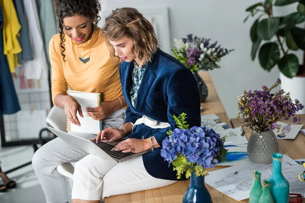 Fashion designers working with laptop — Stock Photo