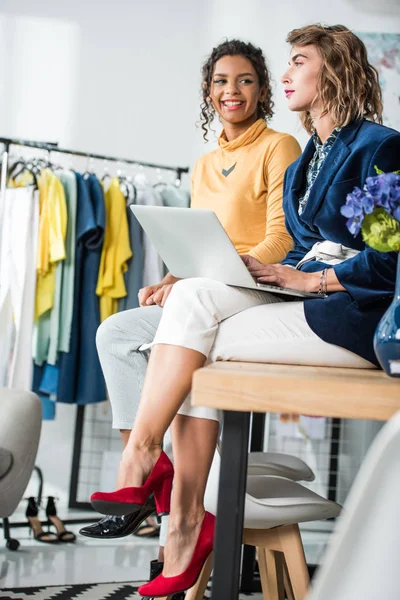 Fashion designers working with laptop — Stock Photo