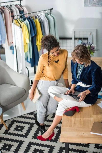 Fashion designers working with laptop — Stock Photo