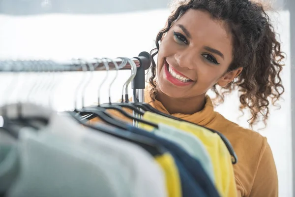 African american fashion designer with clothes — Stock Photo