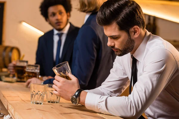 Drunk businessman in bar — Stock Photo