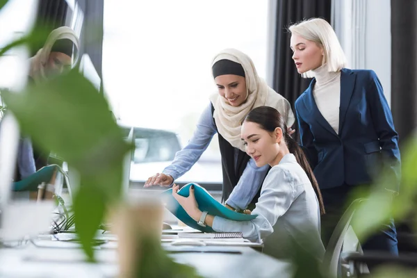 Multicultural businesswomen at workplace in office — Stock Photo
